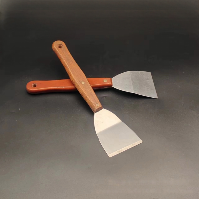 Scraper with wooden handle