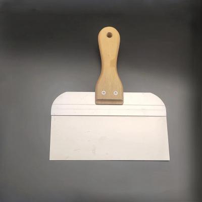 Scraper with wooden handle